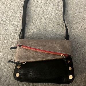 Brand new black and grey leather reversible hammitt crossbody clutch with strap